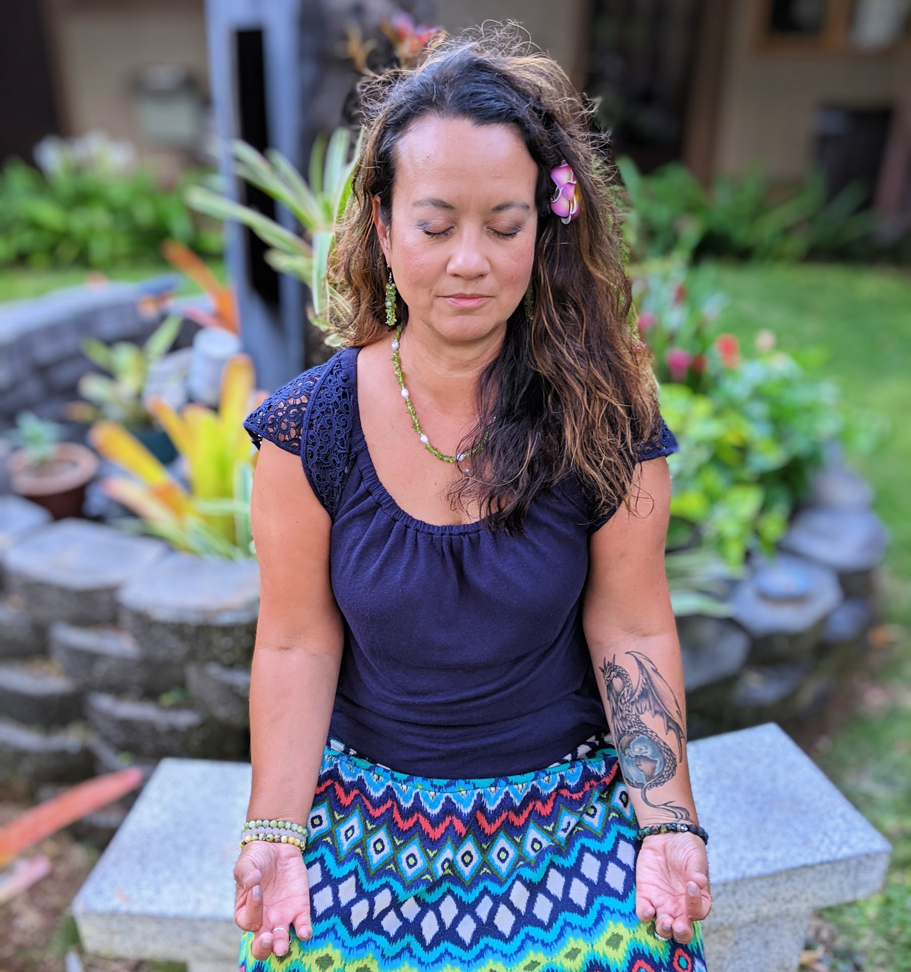 Tina K Clarke posing in meditation reiki healer sq cp